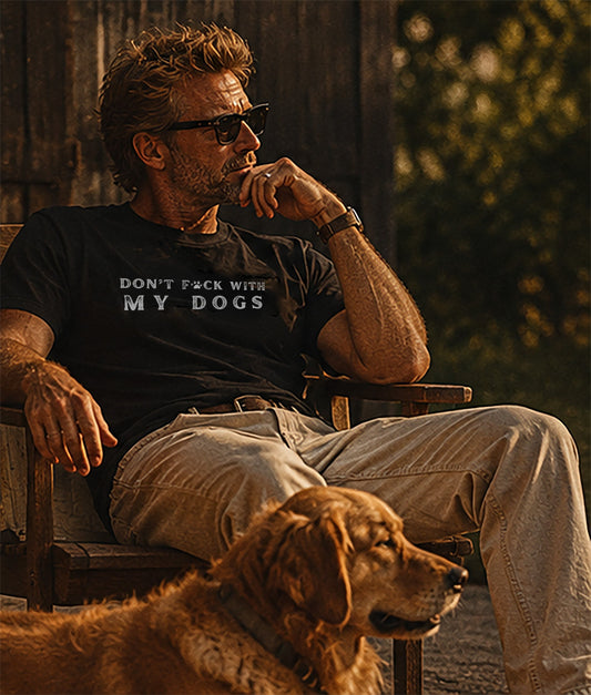 man and golden retriever dog at sunset quietly sitting on a porch
