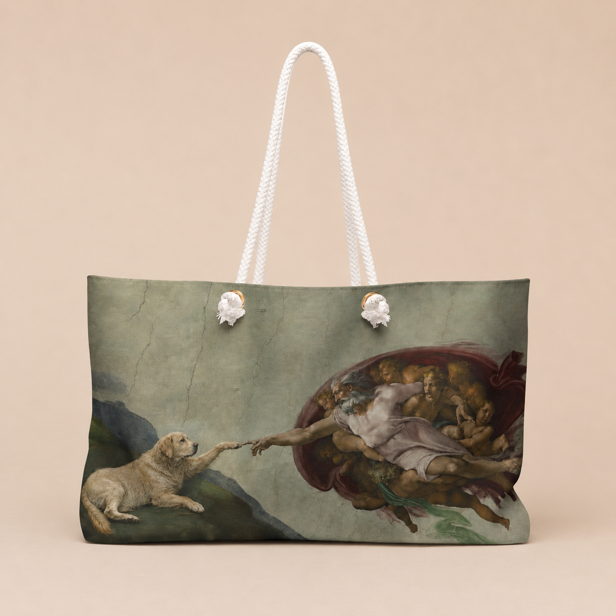 A tote bag featuring a classical painting print of a dog reaching toward a winged figure, with white rope handles, shown against a solid beige background.