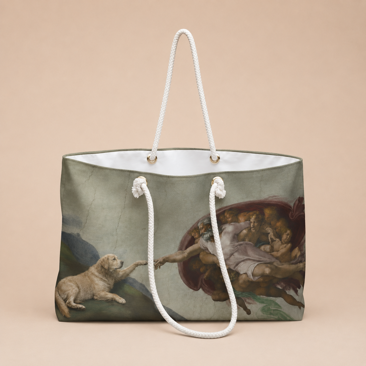 A tote bag featuring a classical painting print of a dog reaching toward a divine figure, with white rope handles, set against a solid beige background.