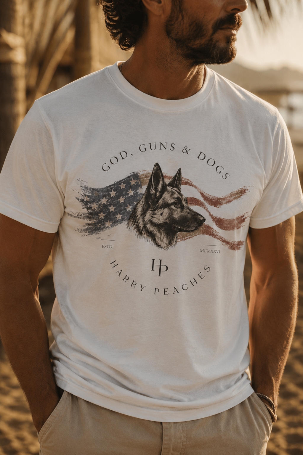 Man wearing a white t-shirt with a graphic of a dog and American flag, brand 'Harry Peaches' visible.