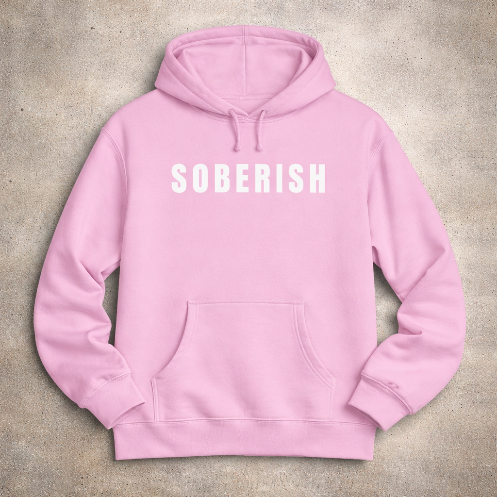 Pink hoodie with 'SOBERISH' text on a beige background